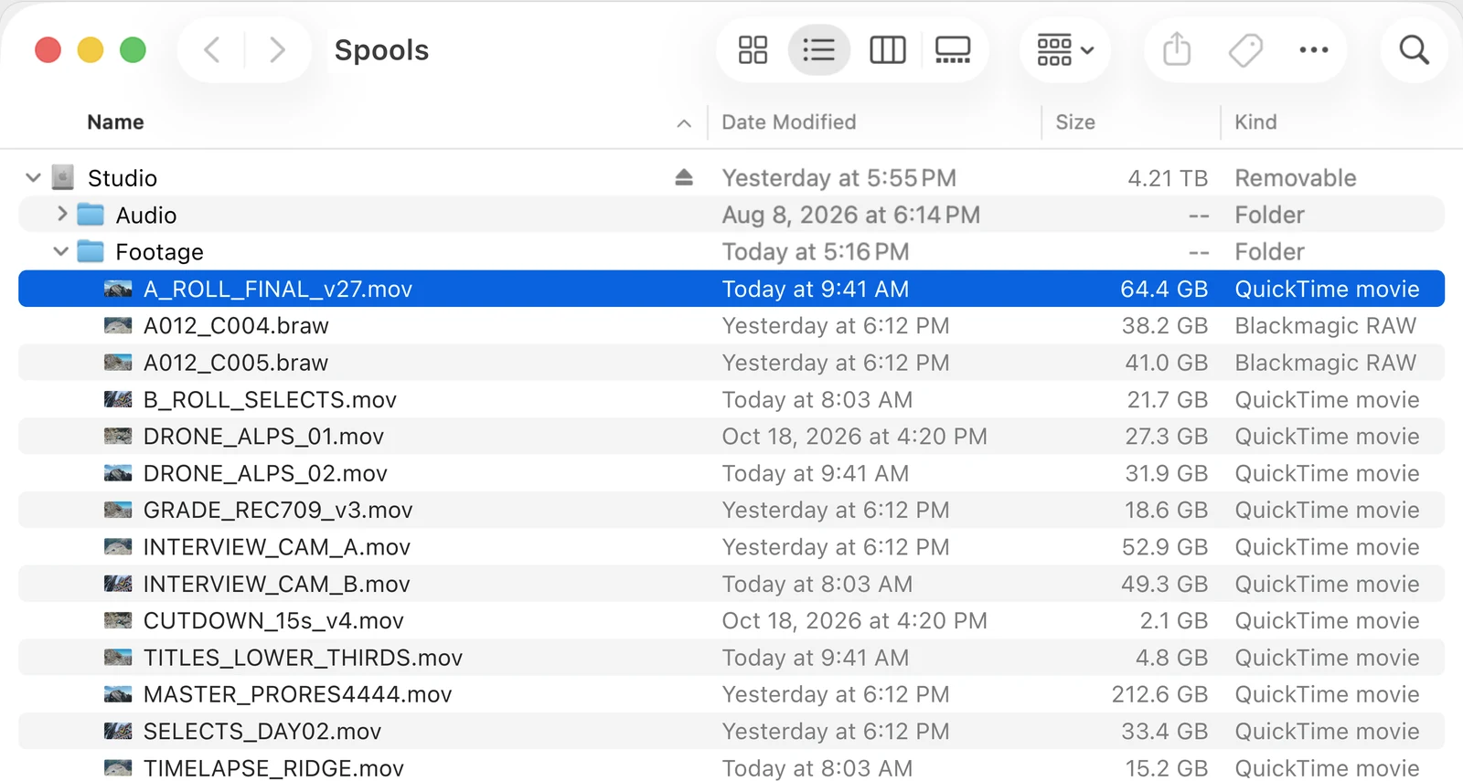 Finder showing the Spools drive, Studio, with a Footage folder of camera files from 2 to 212 GB